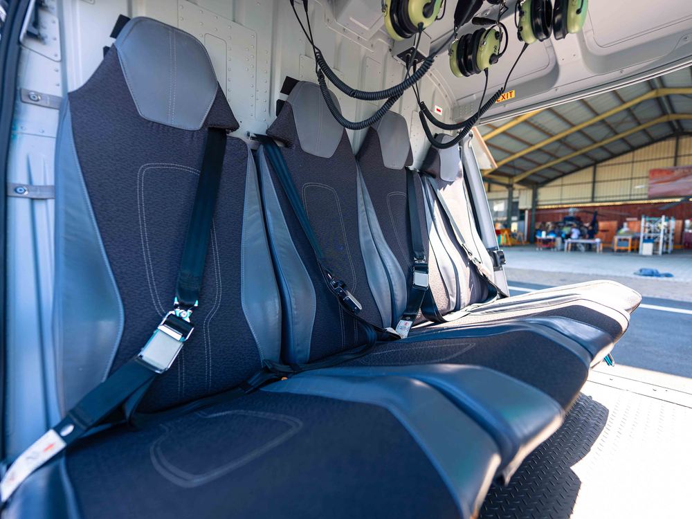 Close-up of the helicopter's leather cabin seats and headsets